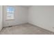 Bright, carpeted bedroom with a large window providing natural light to the interior at 40 Horizon Trl, Garner, NC 27529