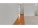 Bright hallway featuring hardwood and carpet floors, and neutral color scheme at 40 Horizon Trl, Garner, NC 27529