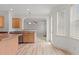 Bright eat-in kitchen featuring a window and door to the outside and modern light fixtures at 40 Horizon Trl, Garner, NC 27529