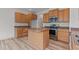 Functional kitchen with wood cabinets, stainless steel appliances, and center island at 40 Horizon Trl, Garner, NC 27529