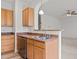Kitchen features stainless steel appliances and warm wood cabinetry providing a cozy feel at 40 Horizon Trl, Garner, NC 27529