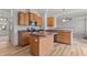 Functional kitchen with wood cabinets, stainless steel appliances, and center island at 40 Horizon Trl, Garner, NC 27529