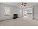 Expansive living room features plush carpeting and a traditional fireplace with lots of natural light at 40 Horizon Trl, Garner, NC 27529