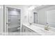 Bright bathroom features a double vanity, large mirror, and separate toilet and shower area at 405 Falls Bluff Dr, Wake Forest, NC 27596