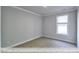 Neutral bedroom with carpet, natural light and base trim at 405 Falls Bluff Dr, Wake Forest, NC 27596