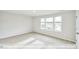 Bedroom with carpet and bright natural light from a large window at 405 Falls Bluff Dr, Wake Forest, NC 27596