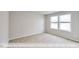 Bedroom with carpet and two windows with bright natural light at 405 Falls Bluff Dr, Wake Forest, NC 27596