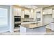 Well-equipped kitchen featuring stainless steel appliances, granite countertops, and an island at 405 Falls Bluff Dr, Wake Forest, NC 27596