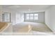 Large loft with carpet, multiple windows and multiple doorways at 405 Falls Bluff Dr, Wake Forest, NC 27596