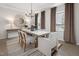Bright dining room featuring a modern chandelier, large mirror, and dining table at 465 Grange Farm Pl, Raleigh, NC 27603