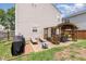 Private backyard with a covered patio, seating, and barbecue area, perfect for outdoor entertaining and relaxation at 4712 Rockport Dr, Durham, NC 27703