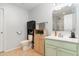 Bathroom featuring a vanity, decorative shelving, and shower with glass doors at 4712 Rockport Dr, Durham, NC 27703