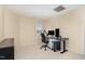 Bedroom with a window, desk, and ceiling fan, perfect for a home office or guest room at 4712 Rockport Dr, Durham, NC 27703