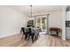 The dining room boasts sliding glass doors, a chandelier, and wood look flooring at 4712 Rockport Dr, Durham, NC 27703