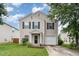Charming two-story home with a well-maintained lawn and attached garage at 4712 Rockport Dr, Durham, NC 27703