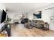 Cozy living room features modern decor, wood flooring, and comfortable seating at 4712 Rockport Dr, Durham, NC 27703