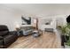 Bright living room with comfortable seating and wood-look floors at 4712 Rockport Dr, Durham, NC 27703