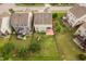 Aerial view of the home showing the backyard with play set, patio, and proximity to neighbors at 5028 Blue Jack Oak Dr, Cary, NC 27519