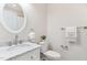 Close up of a bathroom featuring a vessel sink and white marble vanity with chrome hardware and fixtures at 5028 Blue Jack Oak Dr, Cary, NC 27519