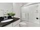 Bathroom featuring granite counters, garden tub with sliding shower door, and updated fixtures at 5028 Blue Jack Oak Dr, Cary, NC 27519