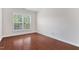 Bedroom featuring a large window with views of the surrounding greenery at 5028 Blue Jack Oak Dr, Cary, NC 27519