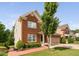 Attractive brick home featuring a landscaped yard and a two-car garage at 5028 Blue Jack Oak Dr, Cary, NC 27519