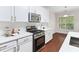 Kitchen with stainless steel appliances, gas cooktop and white cabinets at 5028 Blue Jack Oak Dr, Cary, NC 27519