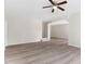View of the open living space with wood-look floors, a ceiling fan, and stairs to another level of the home at 5028 Blue Jack Oak Dr, Cary, NC 27519