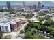 Aerial view showcasing the house nestled among trees in the city at 507 Rosengarten Aly, Raleigh, NC 27603