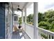 Inviting balcony with ceiling fan, wooden chair, and peaceful views of the surrounding landscape at 507 Rosengarten Aly, Raleigh, NC 27603