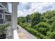 Balcony view overlooking lush greenery, offering a serene and private outdoor space at 507 Rosengarten Aly, Raleigh, NC 27603