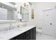 Bright bathroom featuring a double vanity, marble countertop, and modern fixtures at 507 Rosengarten Aly, Raleigh, NC 27603