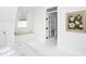 Bright bedroom with a ceiling fan, comfortable bed, and window seat at 507 Rosengarten Aly, Raleigh, NC 27603