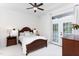 Cozy bedroom with wood furniture, ceiling fan, and access to a private balcony at 507 Rosengarten Aly, Raleigh, NC 27603