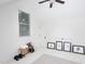Bright bedroom featuring a ceiling fan, natural light, and staged workout space at 507 Rosengarten Aly, Raleigh, NC 27603