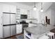 Well-lit kitchen features stainless steel appliances, granite countertops, and white cabinetry at 507 Rosengarten Aly, Raleigh, NC 27603