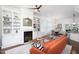 Elegant living room features custom built-ins around the fireplace and flows into dining area at 507 Rosengarten Aly, Raleigh, NC 27603