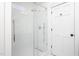 Modern shower with glass enclosure, rain shower head, and bright white tile at 507 Rosengarten Aly, Raleigh, NC 27603