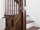 Dark wood staircase features wooden posts and banisters at 507 Rosengarten Aly, Raleigh, NC 27603