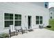 Inviting backyard patio with outdoor seating, perfect for relaxation and entertaining with shade at 514 Alamanni Ct, Graham, NC 27253