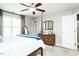 Bedroom boasts soft carpet, a decorative mirror, and access to an ensuite bathroom for convenience at 514 Alamanni Ct, Graham, NC 27253