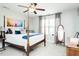 Bright bedroom featuring a four-poster bed, soft carpet, and natural light from a large window at 514 Alamanni Ct, Graham, NC 27253