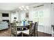 Charming dining area with a glass table, perfect for Gathering meals and entertaining guests at 514 Alamanni Ct, Graham, NC 27253