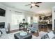 Bright and spacious living room with a fireplace and seamless access to the dining and kitchen areas at 514 Alamanni Ct, Graham, NC 27253