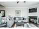Comfortable living room featuring a corner fireplace, plush seating, and a modern design at 514 Alamanni Ct, Graham, NC 27253