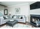 Relaxing living room includes a corner fireplace and cozy seating, creating a welcoming space at 514 Alamanni Ct, Graham, NC 27253