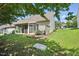 Well-maintained backyard featuring a screened-in porch and lush green lawn at 5421 Brandy Bay Rd, Raleigh, NC 27613