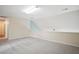 Spacious bonus room on the second floor with neutral carpet and paint at 5421 Brandy Bay Rd, Raleigh, NC 27613