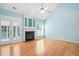 Cozy living room with a fireplace, vaulted ceilings, and ample natural light at 5421 Brandy Bay Rd, Raleigh, NC 27613