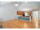 Open concept living room flowing into the kitchen with hardwood floors and bright lighting at 5421 Brandy Bay Rd, Raleigh, NC 27613